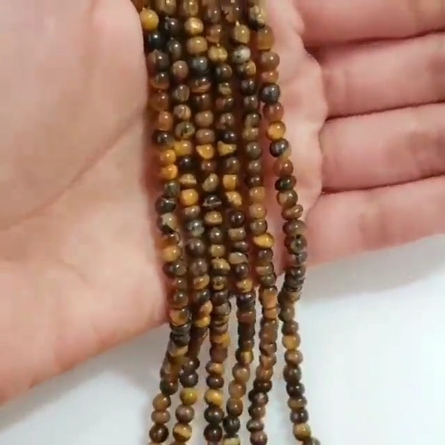 Natural Tiger Eye ROUND Bead Strand Strands are approx. 6.5 inch each in length. Bead size approx. 4 - 4.5mm each