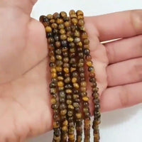 Thumbnail for Natural Tiger Eye ROUND Bead Strand Strands are approx. 6.5 inch each in length. Bead size approx. 4 - 4.5mm each