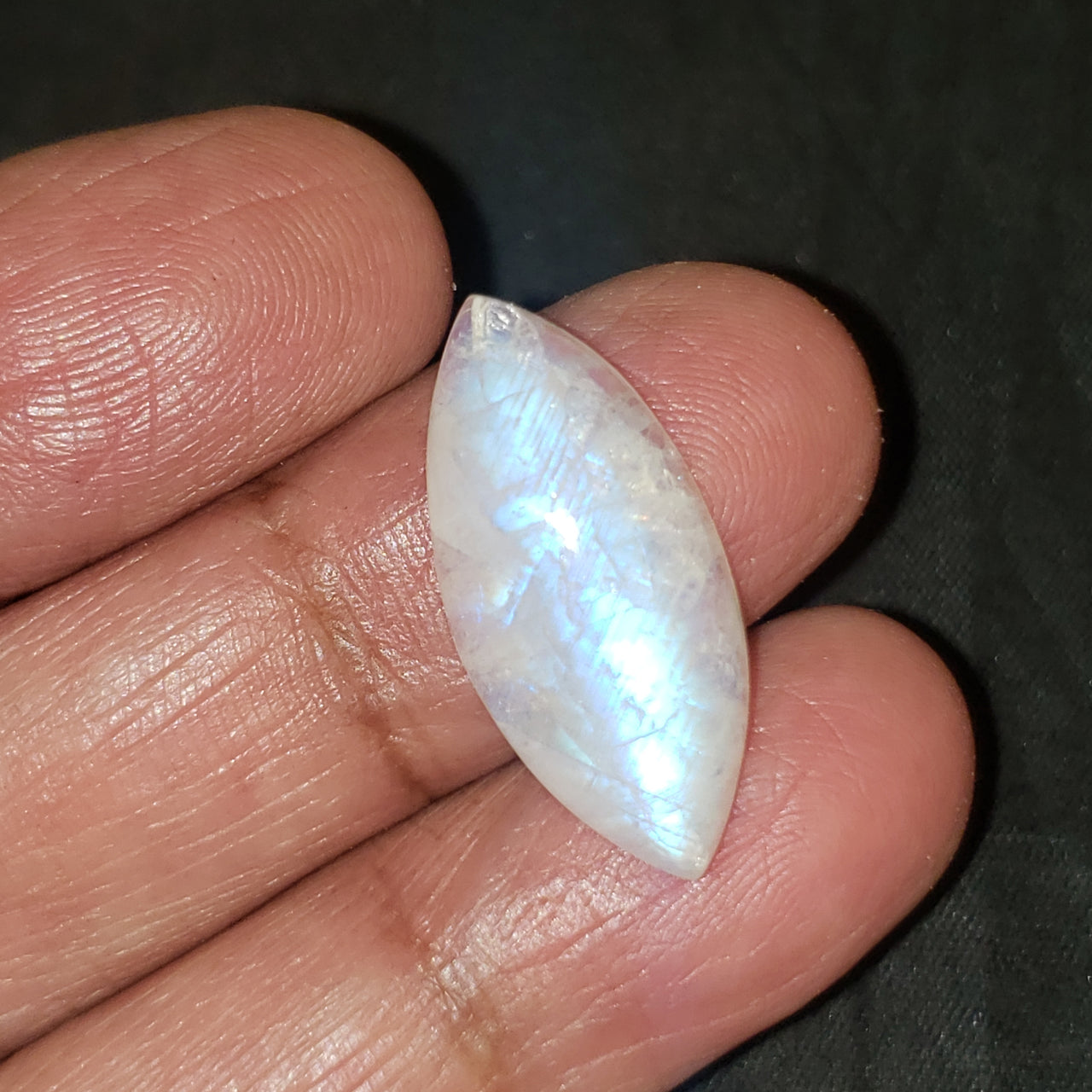 13Ct Natural Rainbow Moonstone Cabochon. Size- approx. 27x7mm