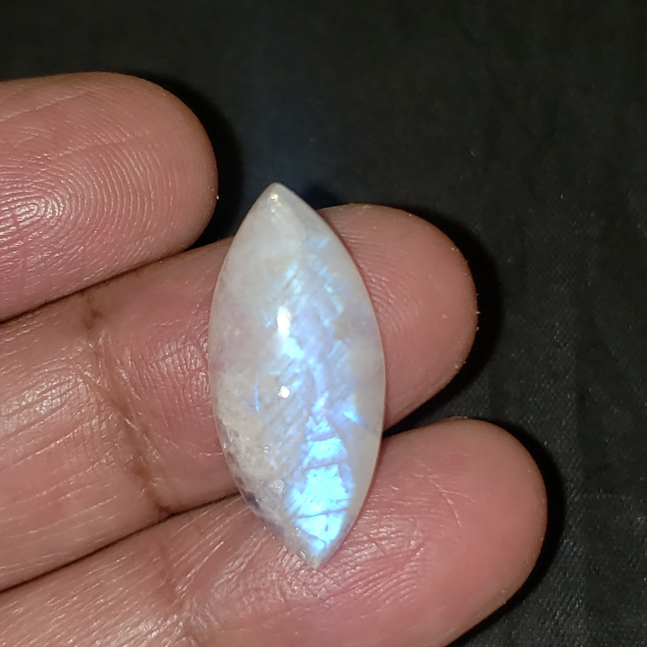 13Ct Natural Rainbow Moonstone Cabochon. Size- approx. 27x7mm