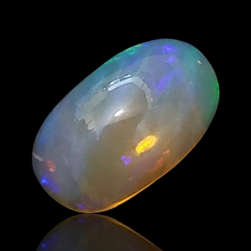 5Ct Natural Ethiopian Opal Cabochon. Size is approx. 15x9mm.