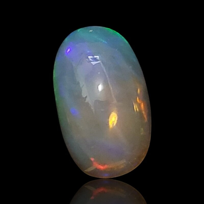 5Ct Natural Ethiopian Opal Cabochon. Size is approx. 15x9mm.