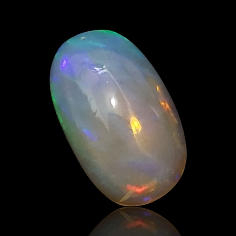 5Ct Natural Ethiopian Opal Cabochon. Size is approx. 15x9mm.