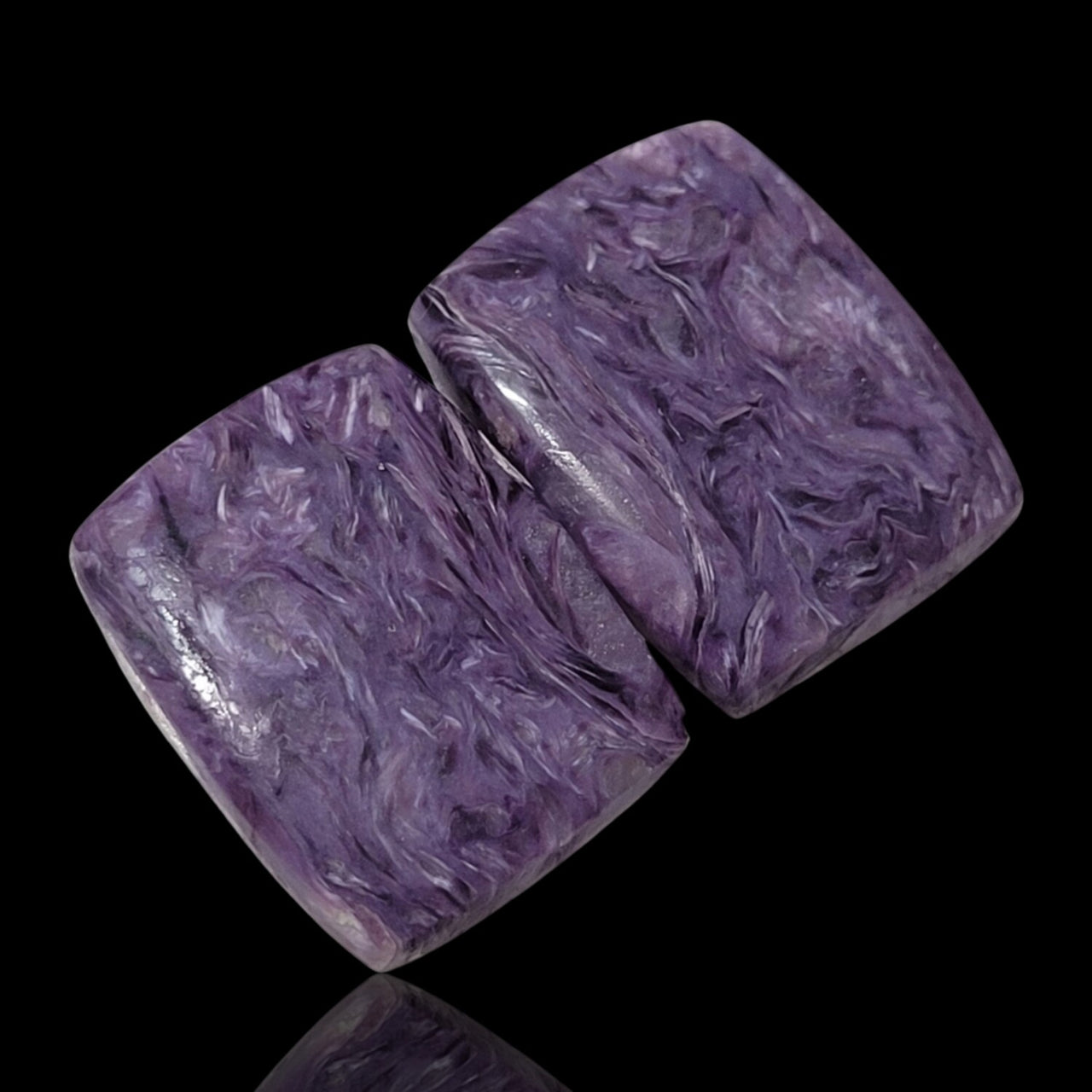 26.5Ct Natural Russian Charoite Cabochon Pair. Size is approx. 20x15mm each.