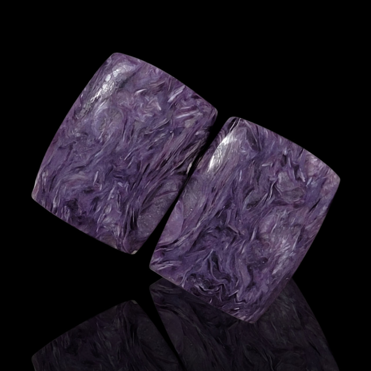 26.5Ct Natural Russian Charoite Cabochon Pair. Size is approx. 20x15mm each.