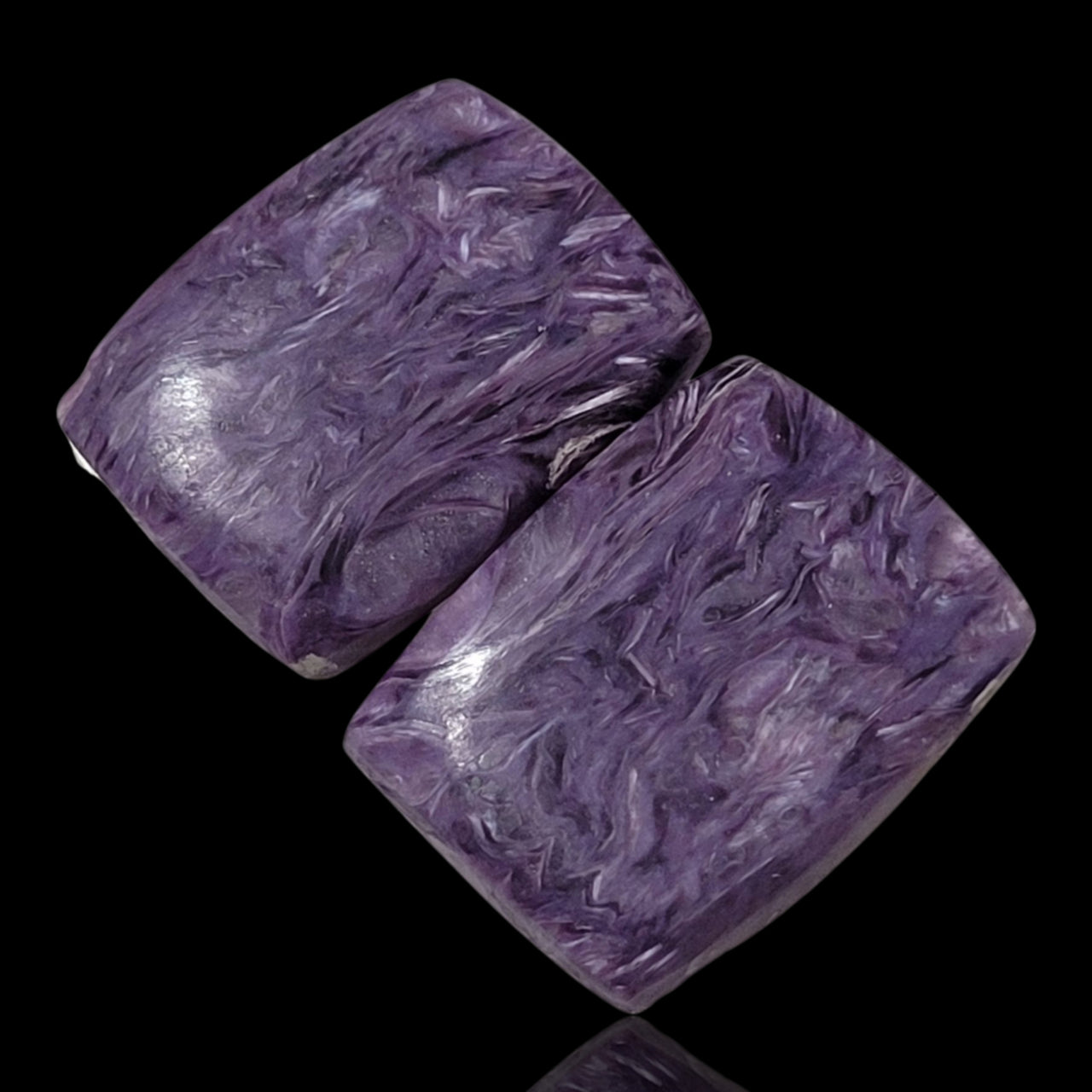 26.5Ct Natural Russian Charoite Cabochon Pair. Size is approx. 20x15mm each.