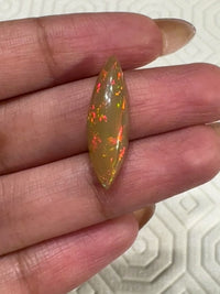 3Ct Natural Ethiopian Opal Cabochon. Size- approx. 22x7mm